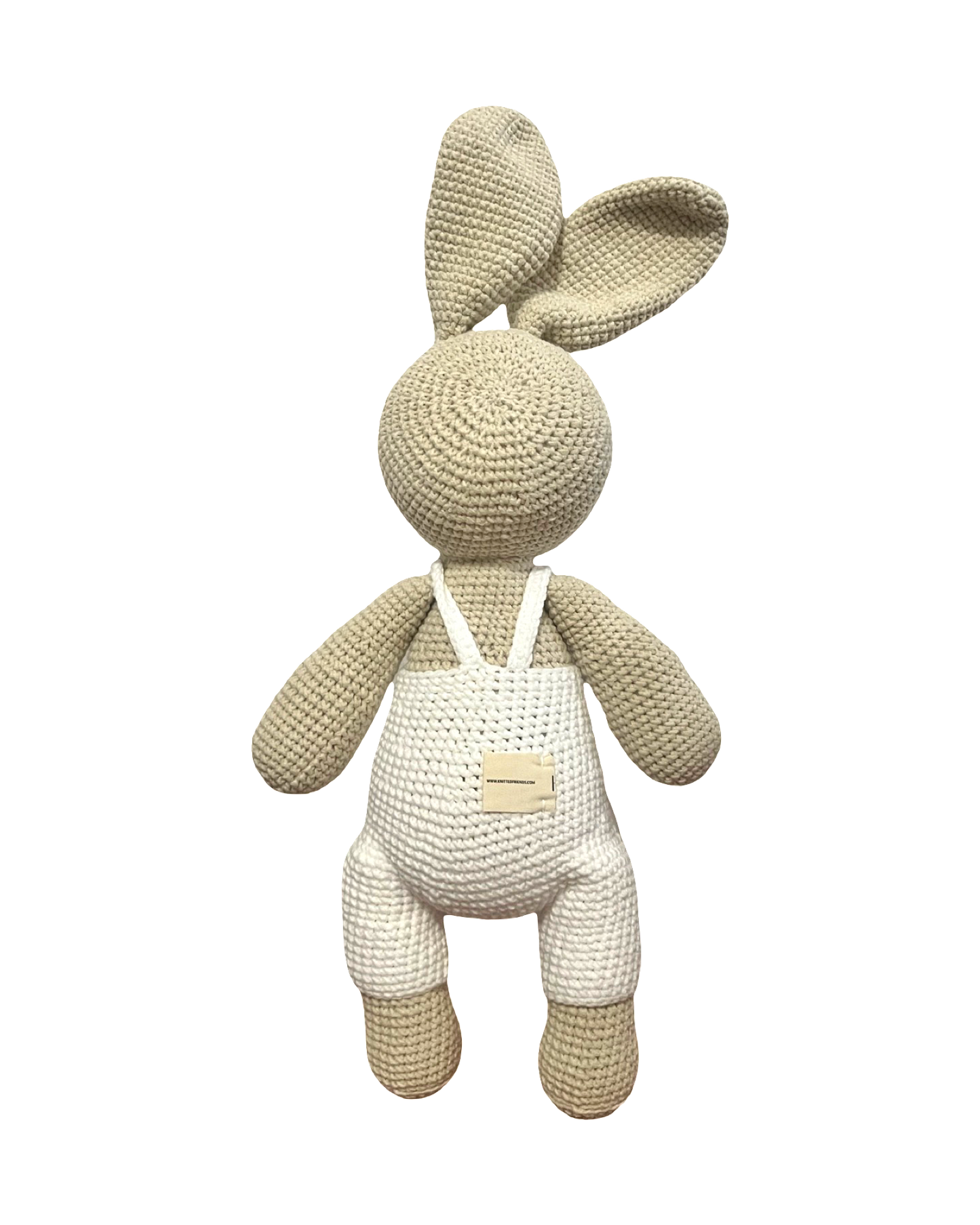 Back view of handmade crochet bunny plush toy in white overalls by Knitted Friends