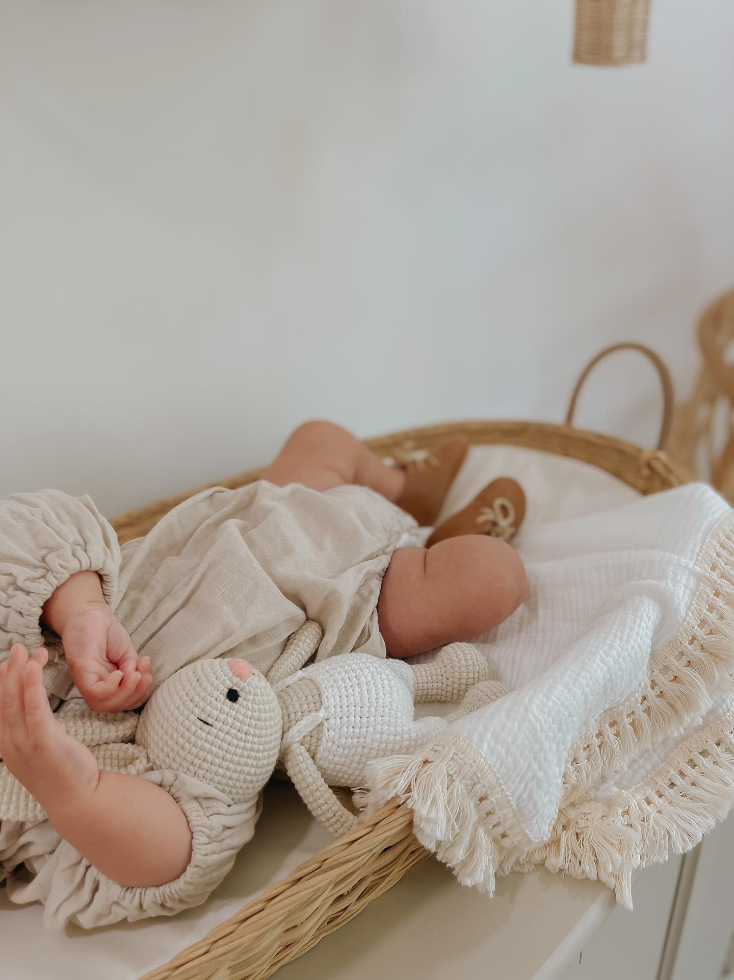 A handmade crochet bunny doll with long ears crafted by Knitted Friends