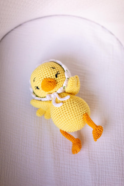 Handmade yellow crochet baby duck doll in organic cotton by Knitted Friends