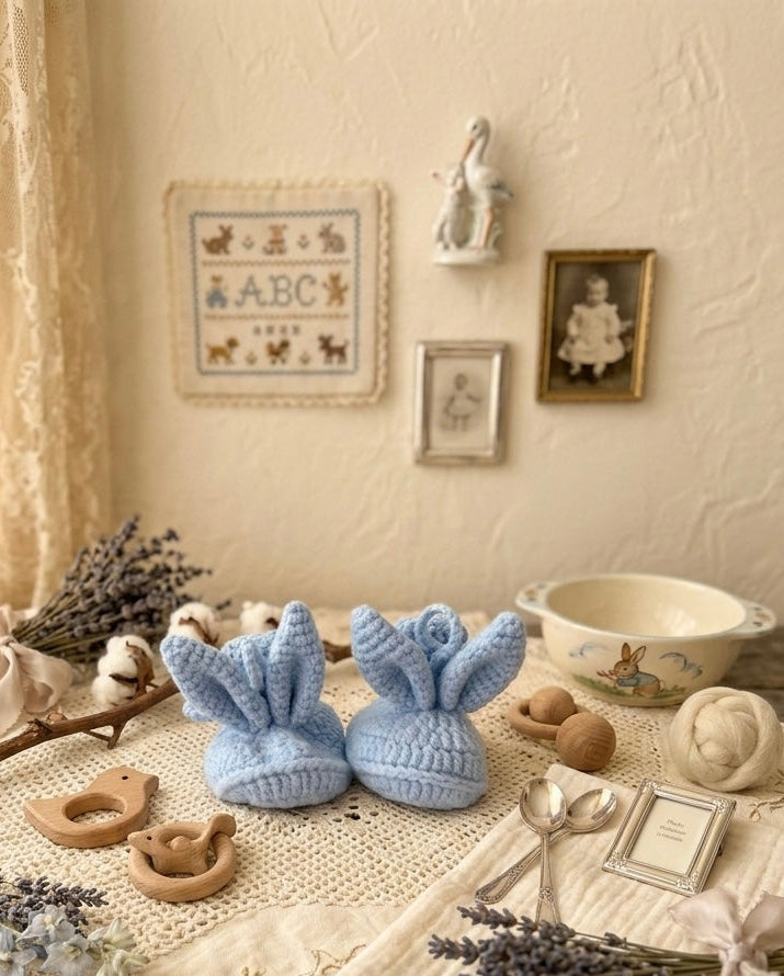 Handmade baby blue bunny booties with knitted ears, soft organic cotton newborn shoes made by Knitted Friends
