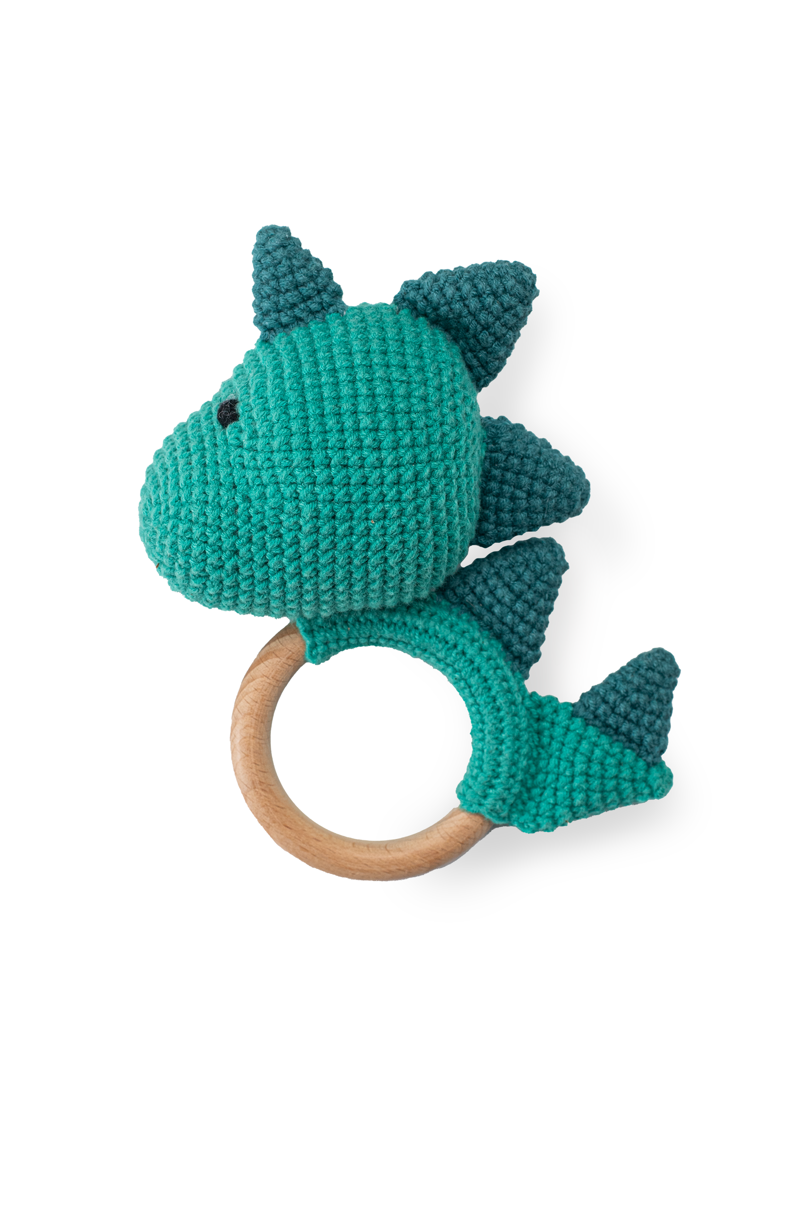 Handmade teal crochet dinosaur teether toy with smooth natural wooden ring by Knitted Friends, featuring detailed dark teal scales, isolated on a clean black background.
