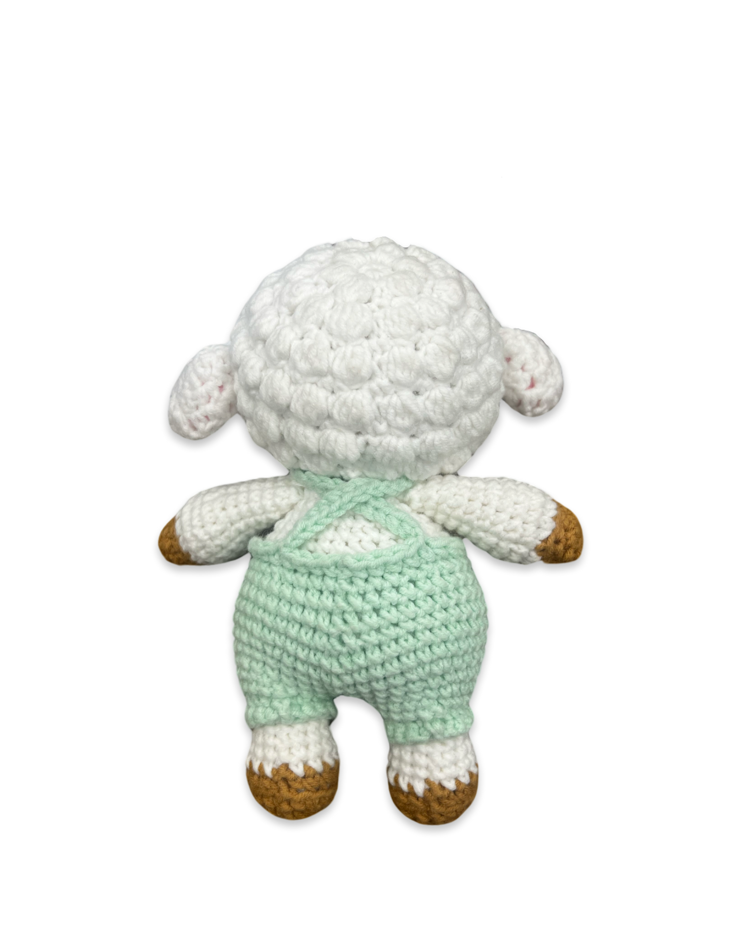 Back view of a handmade crocheted lamb doll with textured white wool and green overalls straps made by Knitted Friends