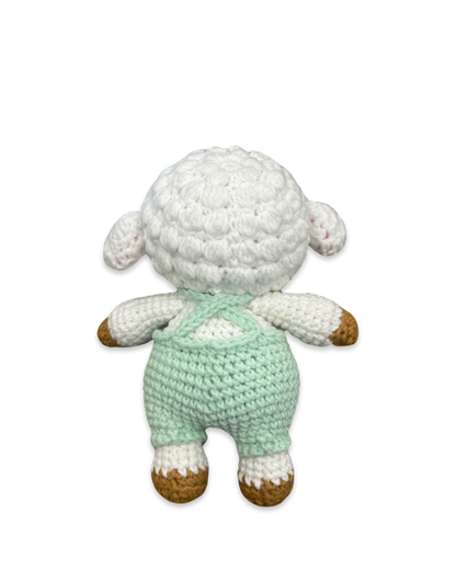 Back view of a handmade crocheted lamb doll with textured white wool and green overalls straps made by Knitted Friends