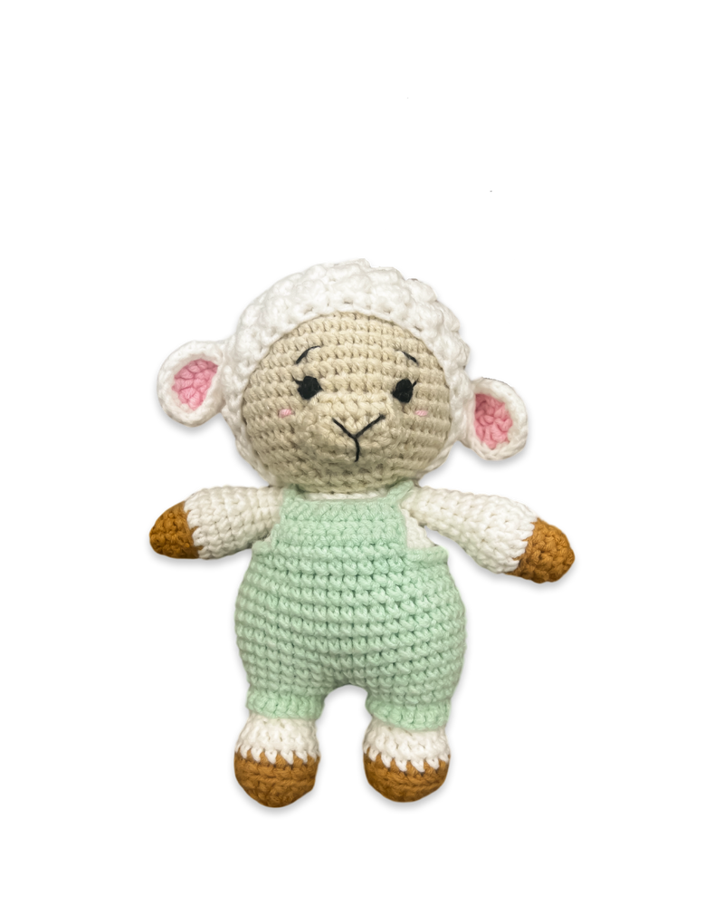 Front view of a handmade crocheted sheep doll wearing a green outfit with soft textured details crafted by Knitted Friends