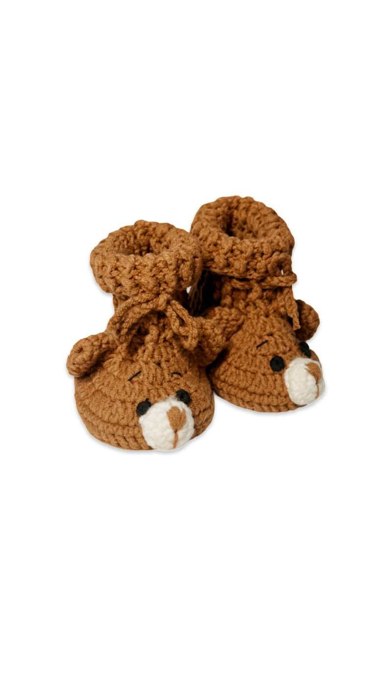 Handmade brown crochet baby booties with cute bear faces and soft textured finish for newborns crafted by Knitted Friends