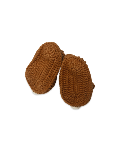 Handmade brown crochet baby booties showing textured soles crafted by Knitted Firends
