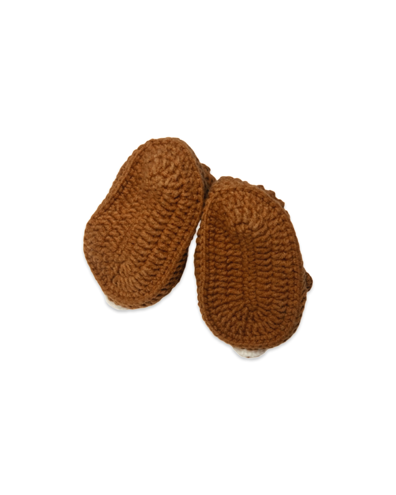 Handmade brown crochet baby booties showing textured soles crafted by Knitted Firends