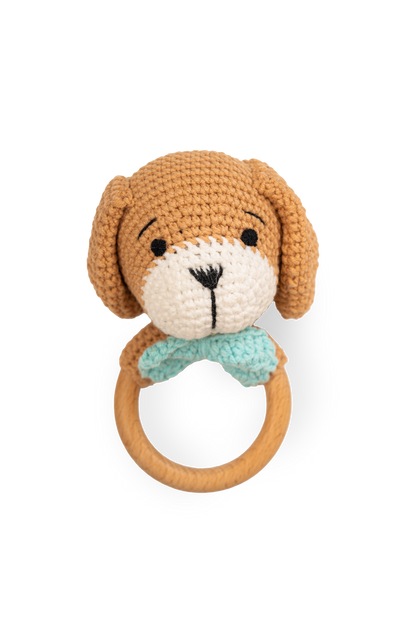 Handmade crocheted puppy rattle toy with wooden ring handle and blue collar detail by Knitted Friends