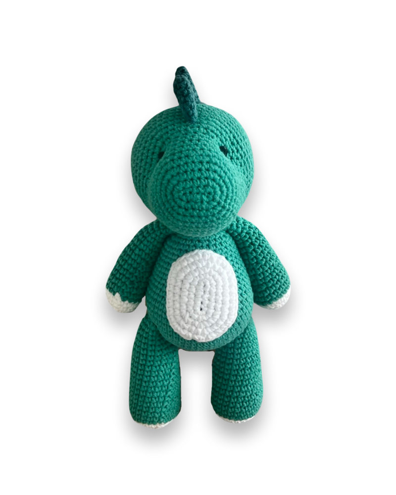 Handmade teal crochet dinosaur plush toy with a white belly and white-tipped feet by Knitted Friends