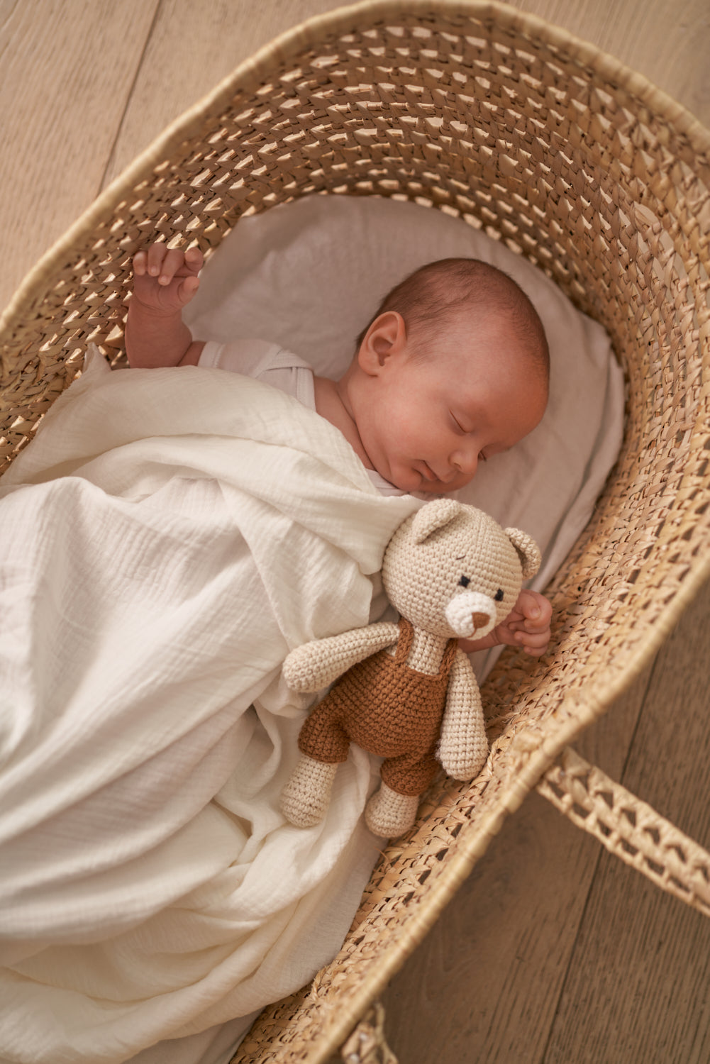 Handmade crochet baby bear doll in organic cotton by Knitted Friends