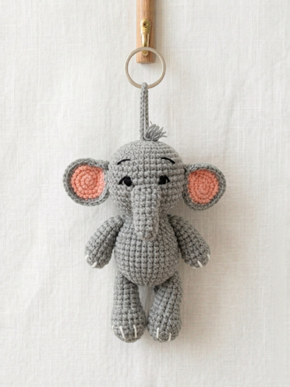 Handmade crochet elephant bag charm in grey with pink ears made by Knitted Friends