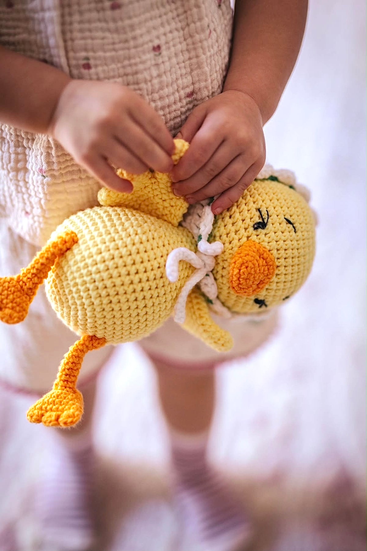 Soft yellow crochet duck doll, handmade in organic cotton by Knitted Friends