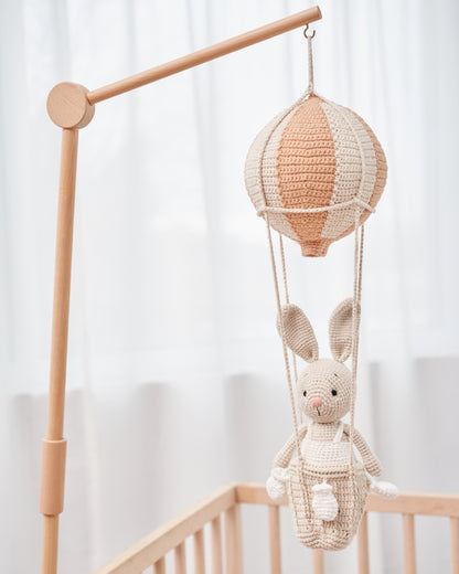 Handmade crochet bunny hanging in a hot air balloon nursery mobile by Knitted Friends