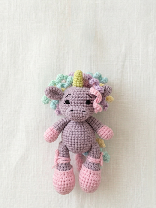 Unicorn Mini Friend, a small handmade crochet unicorn with pastel mane by Knitted Friends