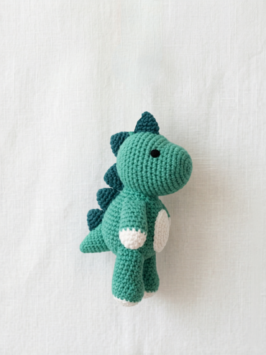 Dinosaur Mini Friend, a small handmade teal crochet dinosaur by Knitted Friends