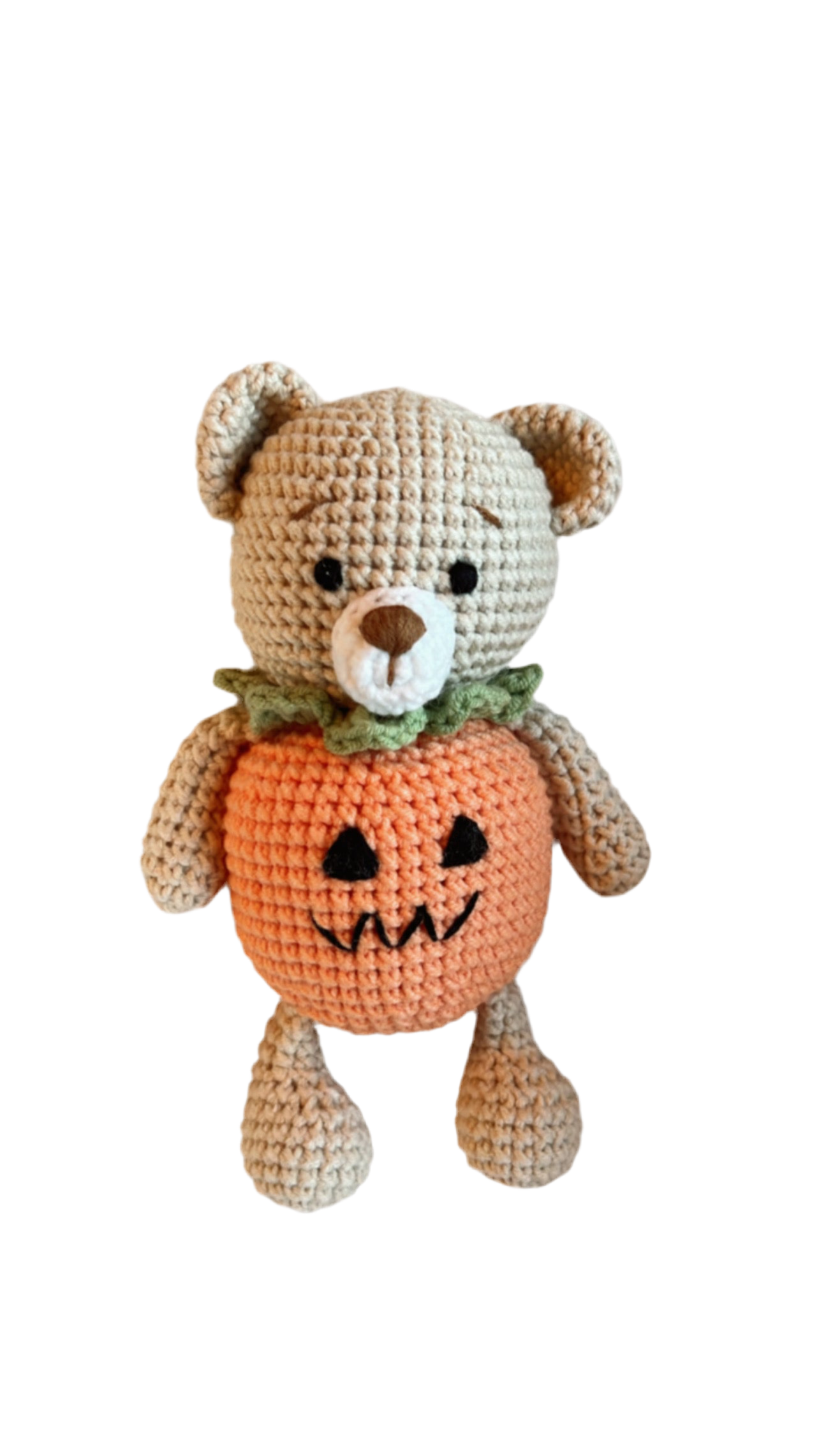Knitted Friends pumpkin bear doll with crochet texture and Halloween pumpkin body, displayed on a black background