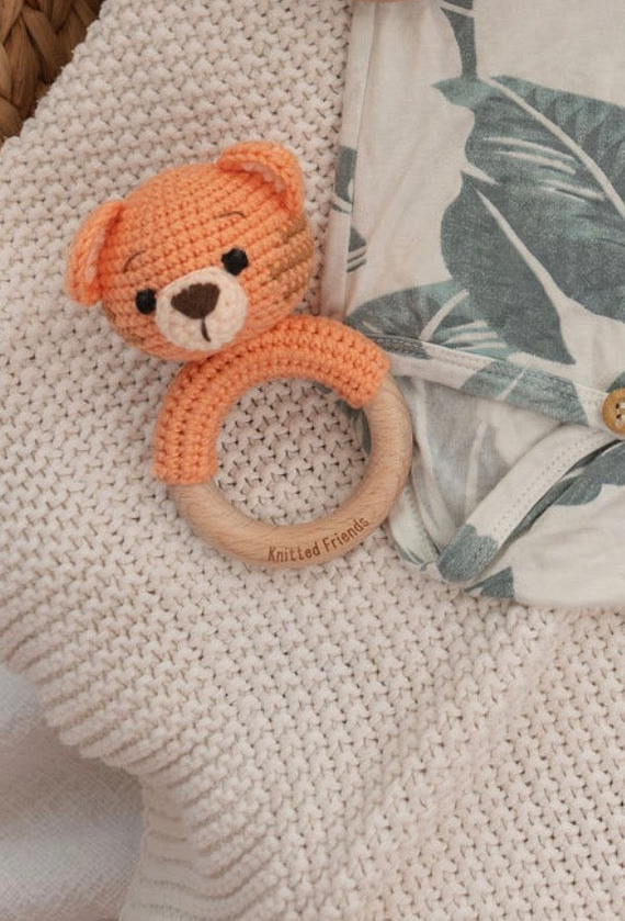 Orange crochet tiger rattle made by Knitted Friends