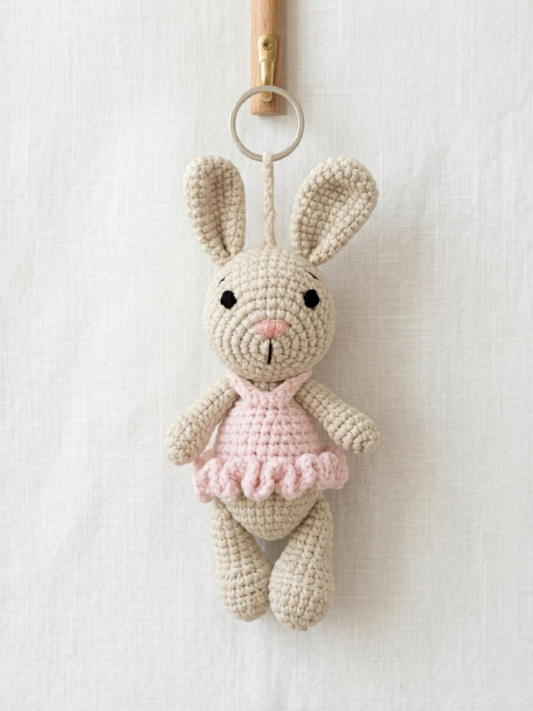 Handmade crochet bunny bag charm with pink tutu dress crafted by Knitted Friends