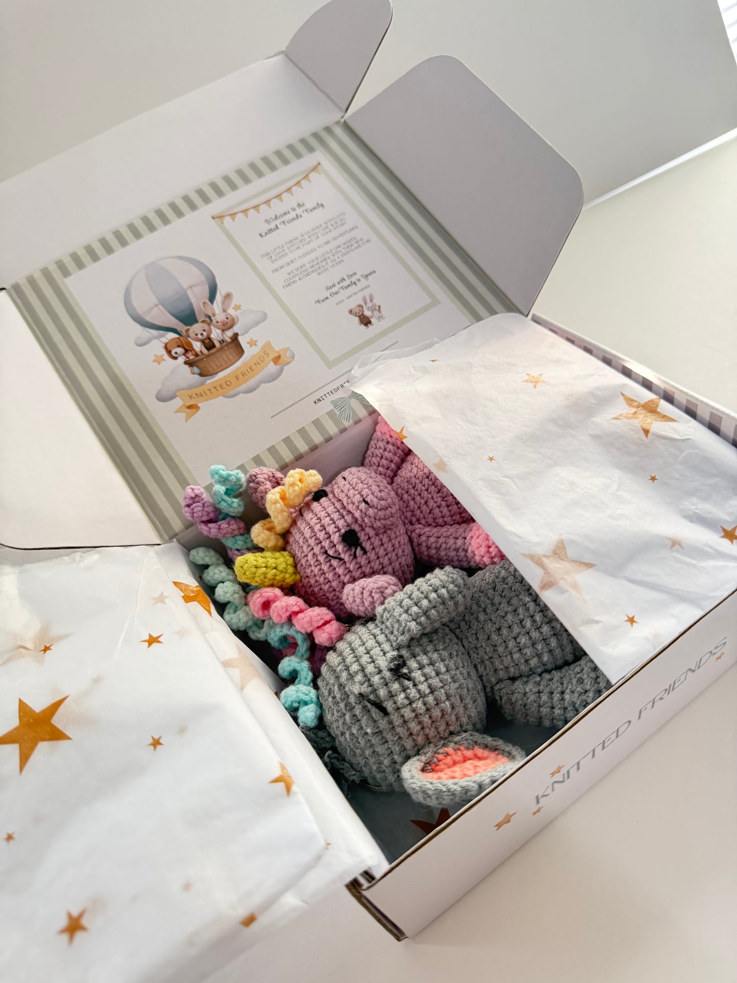 Handmade crochet unicorn bag charm gift packaging with organic cotton toys in Knitted Friends box